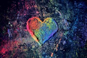 image of a colorful painted heart on a sidewalk
